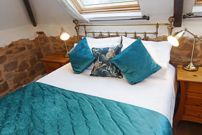 the master king size bedroom has a door to a balcony with seating area and spectacular views